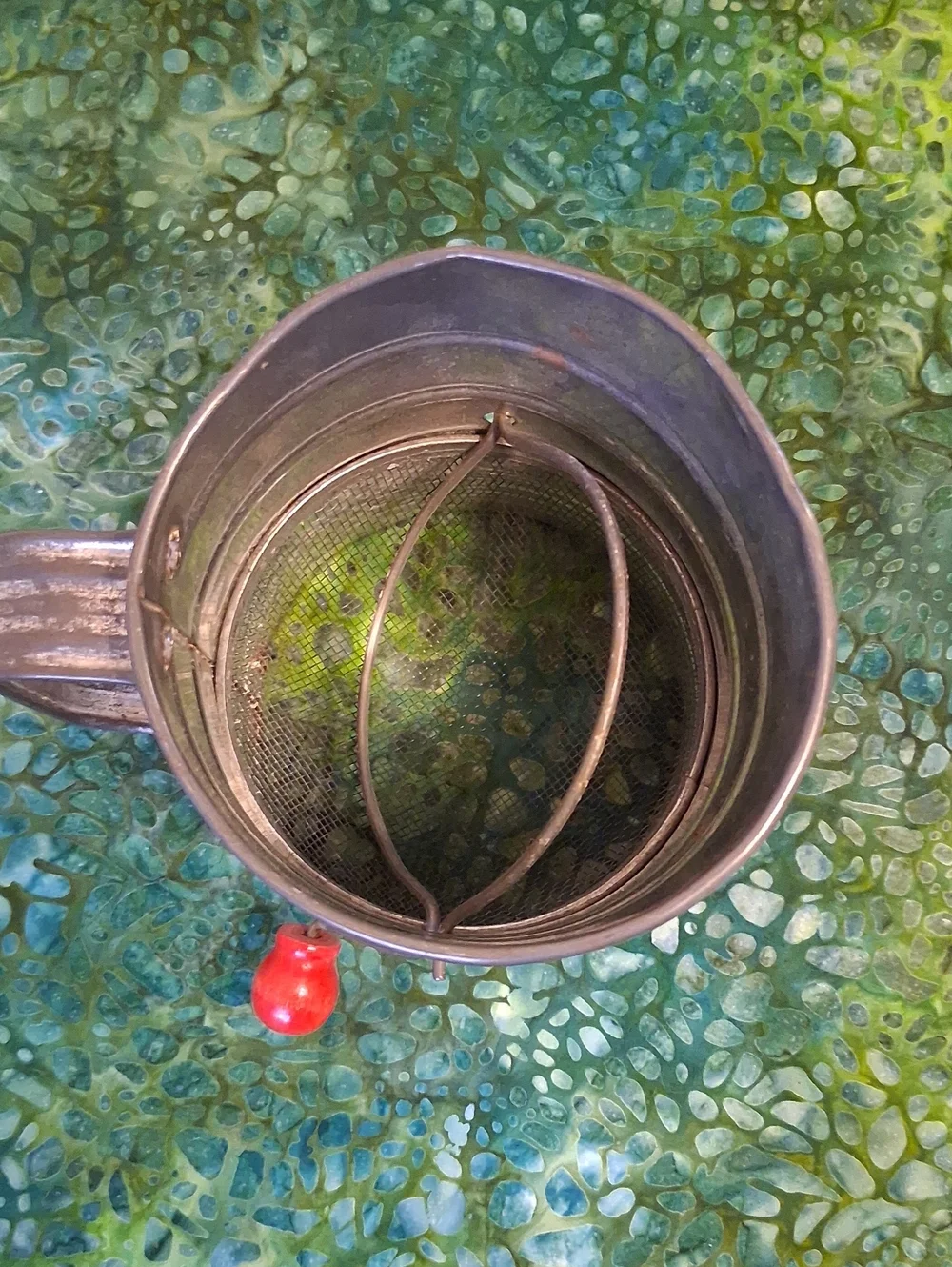 Vintage Cream Metal Flour Sifter with Red Apple Motif